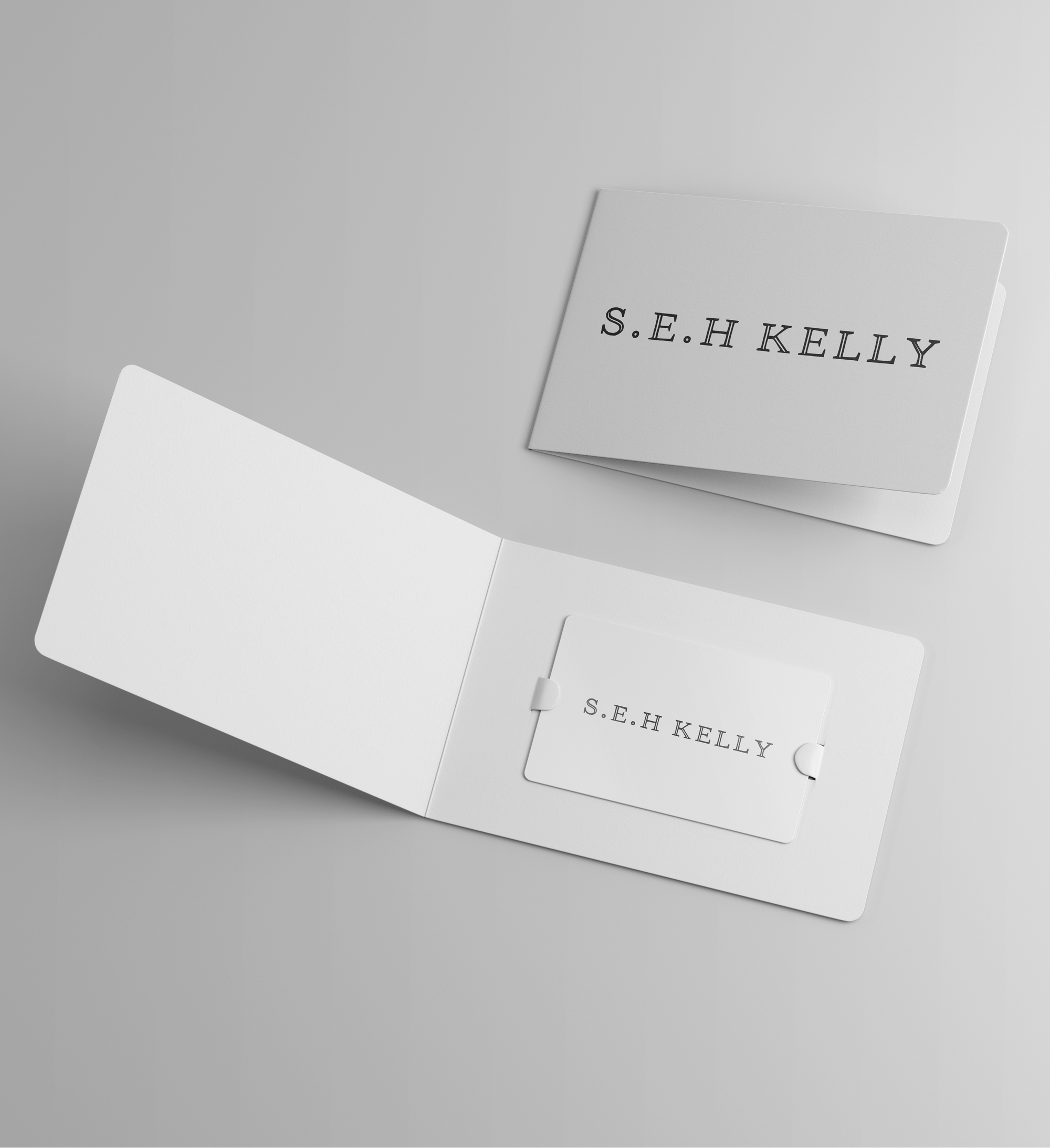 S.E.H Kelly gift card set on a gray background
